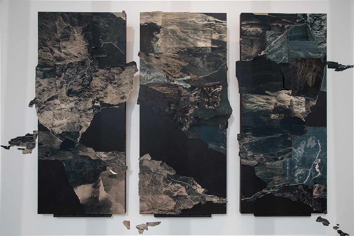 The work features collages of cyanotype photographs taken in the American Southwest, multichannel field recordings, and objects collected within the land on three suspended wooden panels.