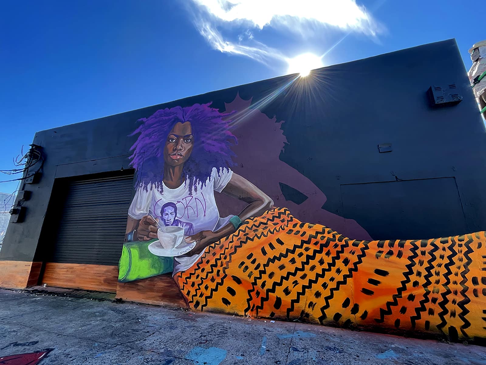 Vibrant Painting of a Black Woman relaxed while holding a Tea cup.