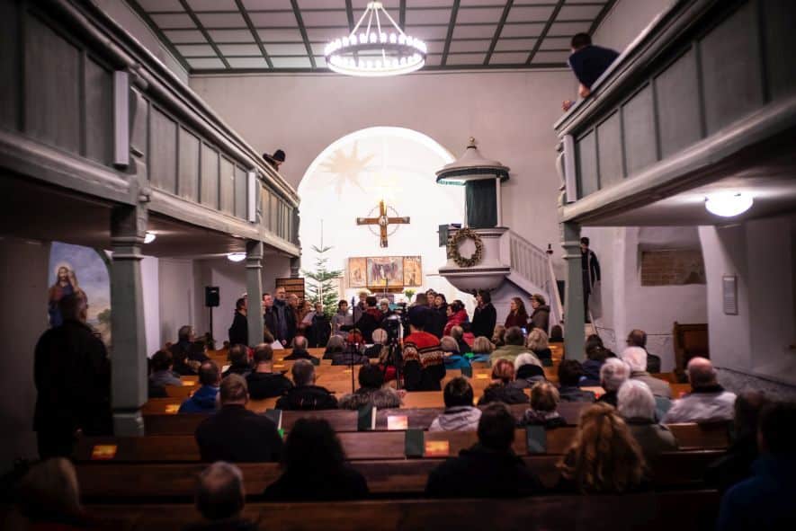 Choir Performance The Bells of Mutzschen at Church Mutzschen with people of the region about the melting of bells in wars.