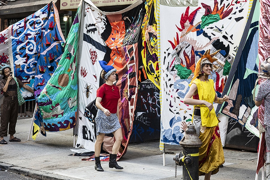 Documentation from public processional where community members helped activate the tapestry. Stitched in isolation, the 100 foot long story-scroll records the cascade of extreme weather and news events that occurred each month of 2020. In collaboration with other Rebecca Pristoop and The Moving Company and Friends, the project is an evolving invitation for public procession and collective meaning exploring the malleability of memory and symbols, seeking to stimulate curiosity and wonder toward the natural world through movement, color and form.