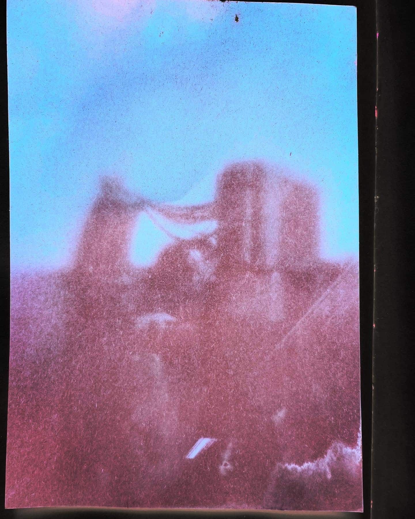 Photograph of AC vents on a rooftop taken with a homemade lenticular pinhole camera.