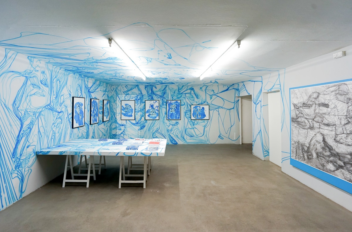 DRAWN 2022 wall drawing acrylic paint on wall books, table drawings framed, vacuum drawings, pigment on canvas