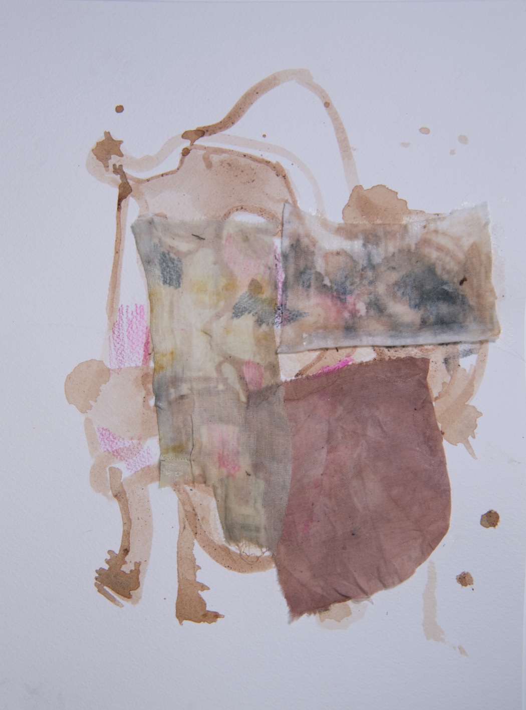 A white page with overlapping abstract forms in the centre. The marks are made with ink, fabric, and paper.