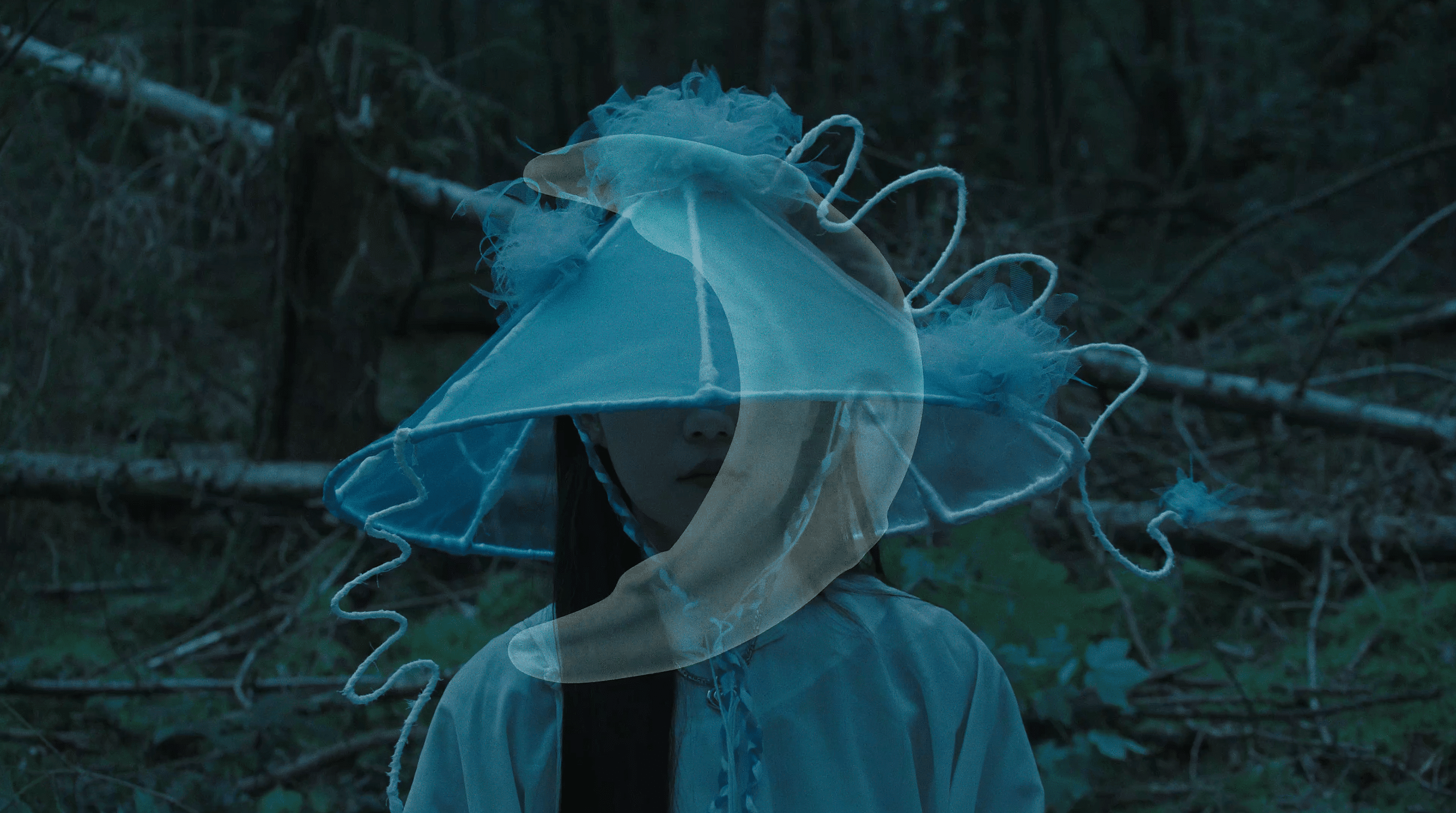 An image of a moon overlapping on a women wearing a hat