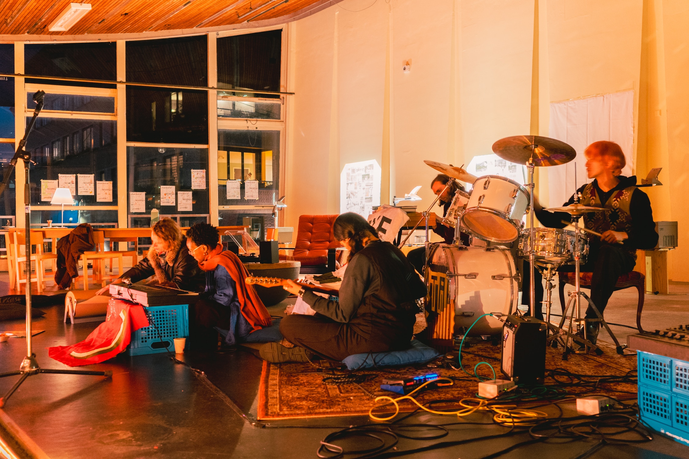 Five people are jamming together on the stage