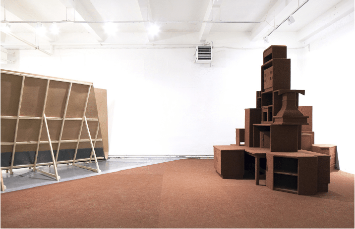 Donated household furniture by a local community from Prague in Czech Republic is constructed tightly and wrapped in a carpet that was used between the 1960’s and the 80’s in an office of the Communist Party. The resulting structure is the monument of the history of the Czech Republic. The work highlights the notion of the word “Community.” The result is a monument to illuminate the history of Czech citizens and their "community". This work has examined the relationship between the state and the citizen by using the two terms "Community".