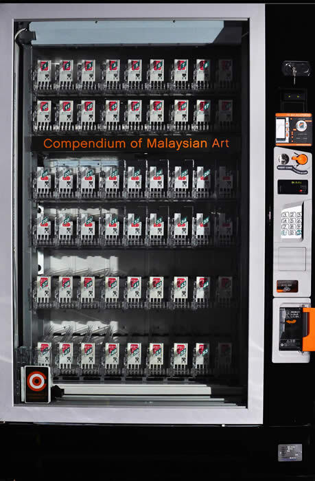 Coma: 38/500 redefines authorship and value by transforming Art Basel Hong Kong into a metaphorical vending machine. Featuring contributions from 500 Malaysian artists, the project subverts elitism and commercialism, highlighting collective creation, inclusivity, and the complexities of artistic identity within Asia’s evolving contemporary art landscape.