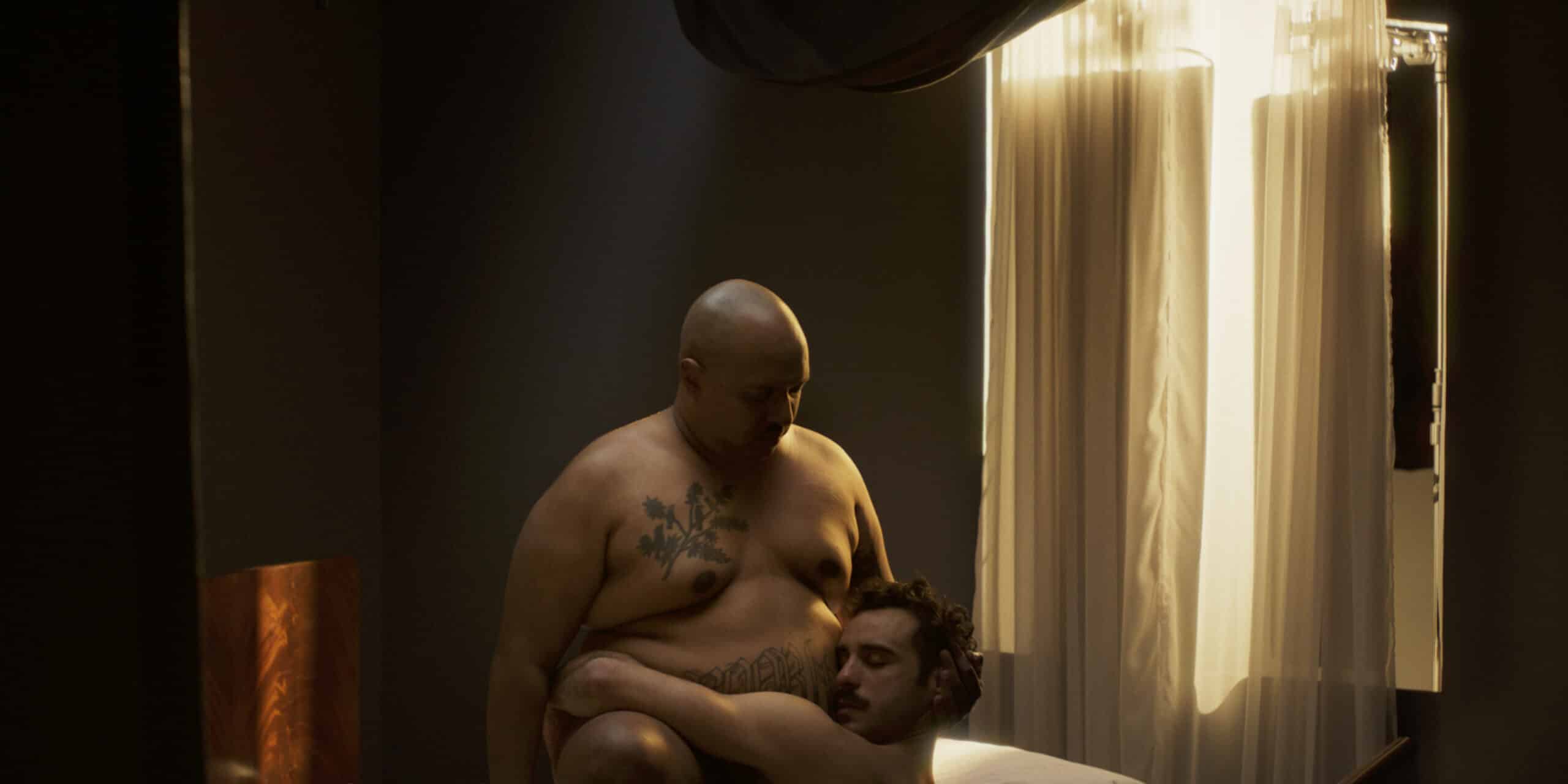 ‘…Closer to God…’ is both an explicit and intimate visual study of the discourses that determine which bodies are deemed desirable and worthy of admiration in a sexualised economy. In a stylised tablaeu, lit like renaissance paintings, the camera examines bodies frozen in embrace and desire. Poetically disseminating knowledge about the discrimination of fat people as it relates to career and financial opportunities The interweaving of explicit intimate imagery and scientific research reveals discourses judging which bodies are deemed worthy of sexualization and the financial consequences that follows.