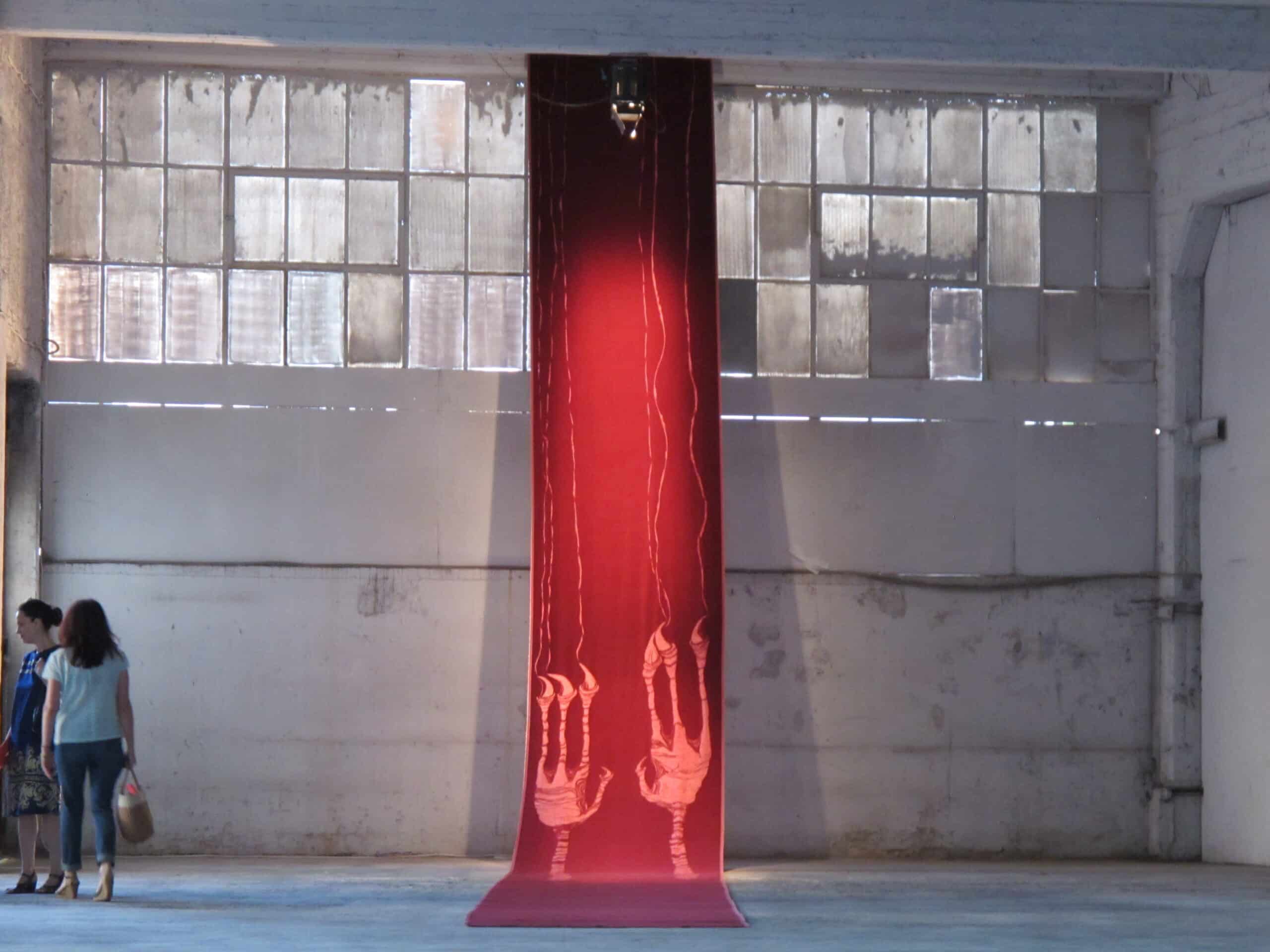 Red Carpet is a velvet installation with the imprints of a predatory imaginary being that unfurls from ceiling to floor; a work directly related to power and its relationship with finitude. TATE Permanent Collection