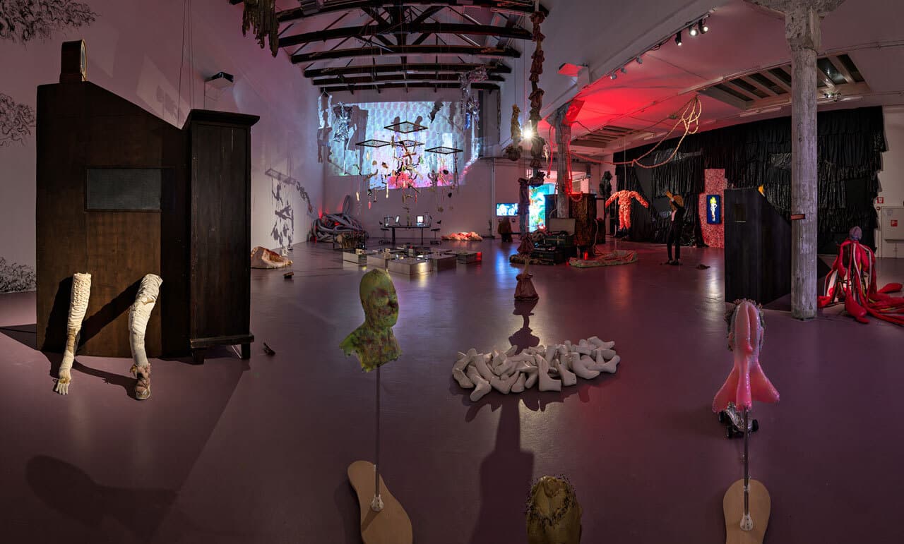 dark space with several artwork in it