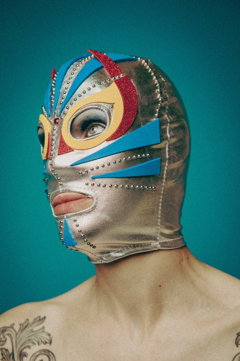 It is a multidisciplinary project structured in modules between artisanal practice, photos, videos, performances and a collective self-defense course. Luchadoras is a multidisciplinary project, supported by Fondazione Solares delle Arti, celebrating female agency and empowerment through the iconic figures of Mexican lucha libre. The work combines historical research, design, performance, and social activism to create a dialogue on inclusion, resilience, and autonomy. At the heart of the project is a performative happening: a free self-defense course for girls and women, fostering the rediscovery of the body as a tool of strength, harmony, and expression. This experiential action integrates with a visual narrative, where handcrafted masks worn by the artist serve as metaphors of transformation and resistance against gender-based violence. Ketra draws inspiration from luchadoras who, through their masks, turned experiences of abuse and marginalization into acts of power and visibility. Each of the nine masks functions as a visual manifesto of identity and empowerment, translating personal and collective resilience into an aesthetic and socially engaged artistic intervention.